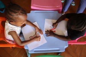 Children receiving gifts at the Christmas celebration