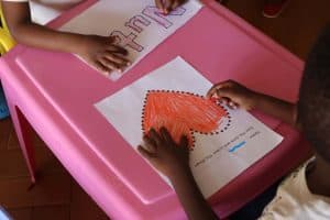 Jetlak volunteers with children at New Life Home Trust